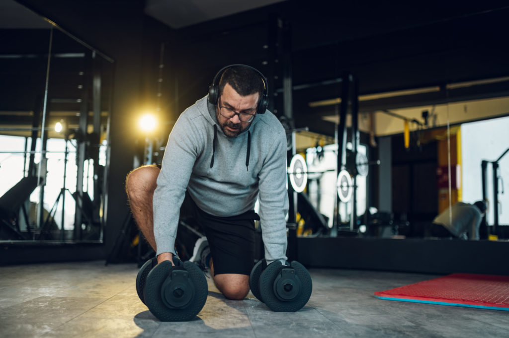 middle aged men training in the gym and using dumb 2022 04 11 20 55 31 utc scaled