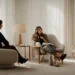 a person sits across from a therapist in a calm, welcoming room, engaging in a deep conversation.