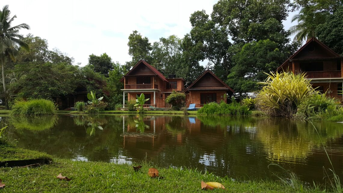 a house next to a pond