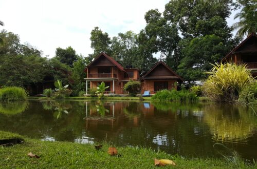 a house next to a pond