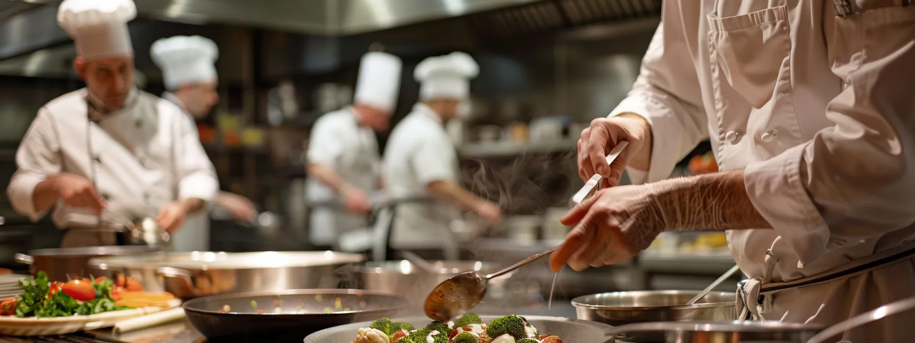 professional chefs demonstrating advanced cooking techniques in a nyc culinary class.